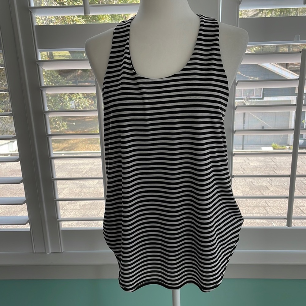 Calia by Carrie Underwood. Active wear. Black and white striped top. Size medium